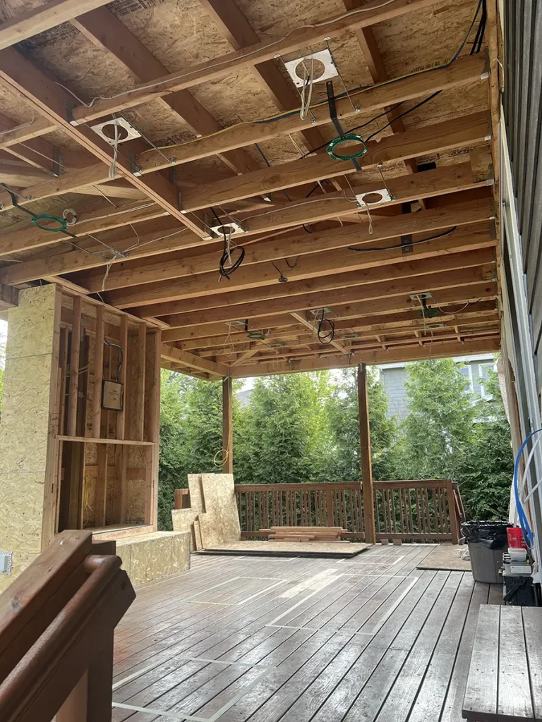 Patio undergoing renovation with exposed new wiring.