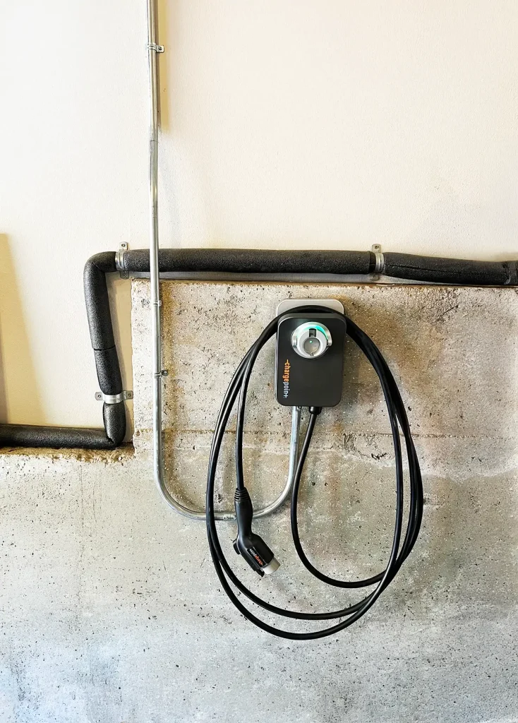 Electric car charger mounted to the wall
