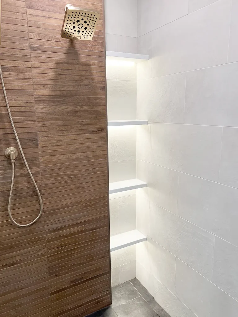 Shower room with LED lights in shelves